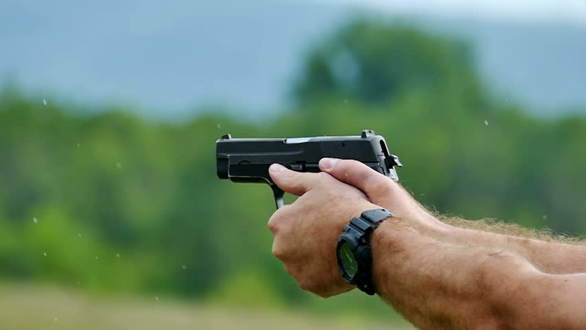 man pointing a gun