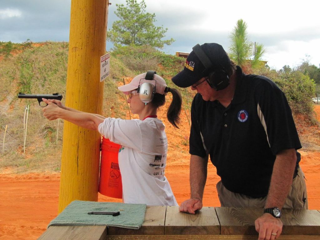 woman practicing to shoot