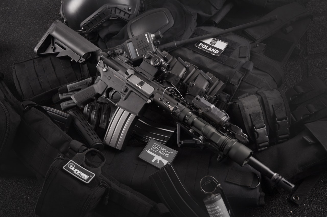 AR 15 rifle on top of black cloth with ammo