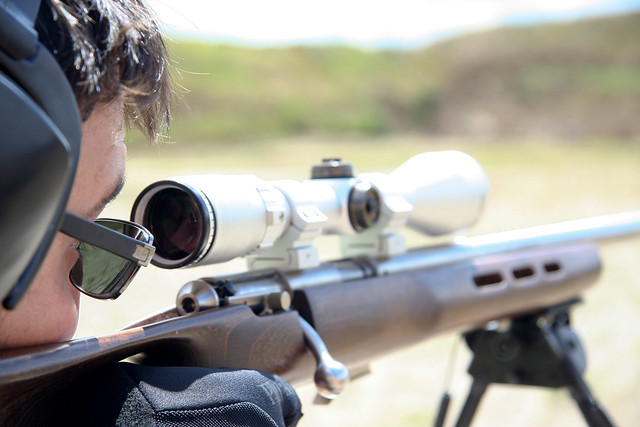 man using a sniper with scope